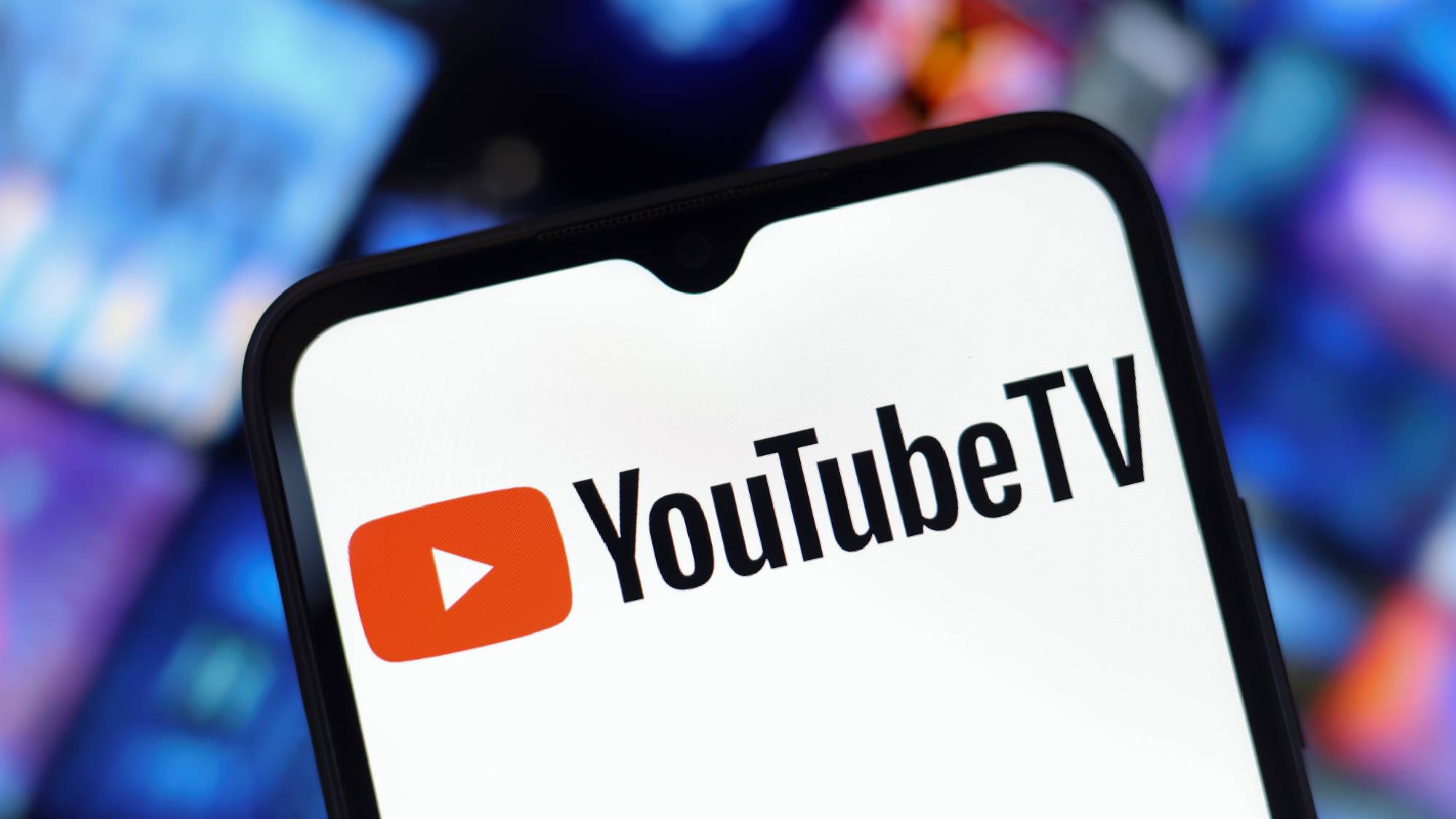 YouTube TV logo on a smartphone screen with a blurred background
