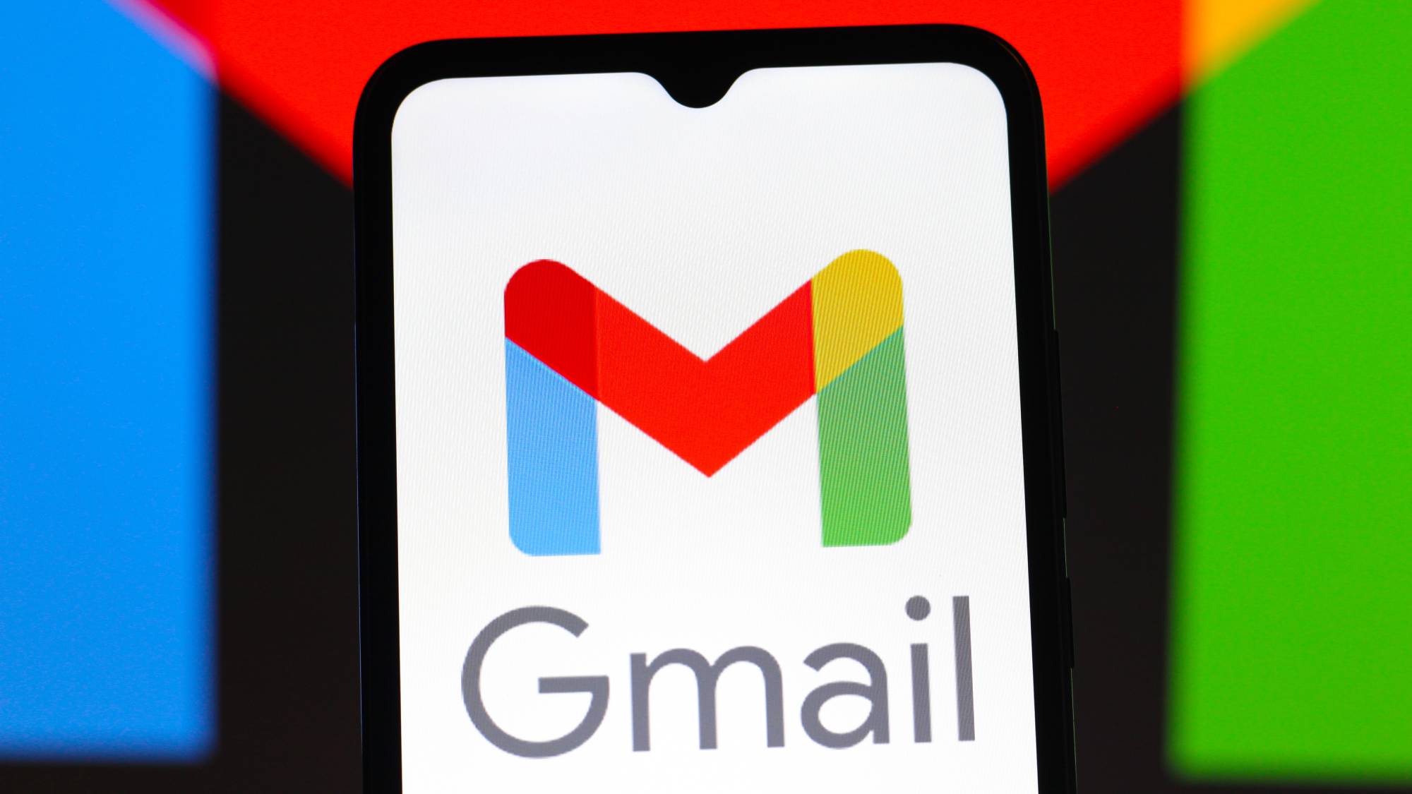 Gmail app logo displayed on a smartphone screen against a colorful background